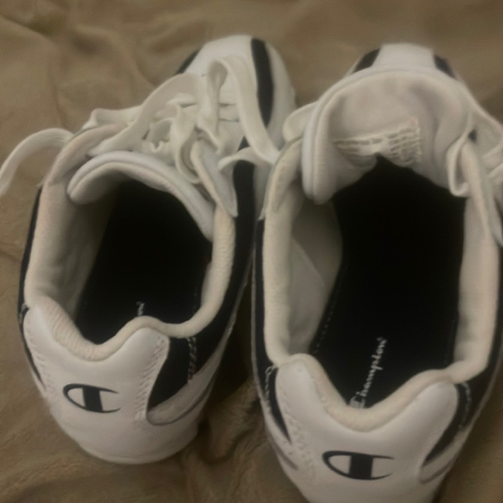 White Champion running shoes.